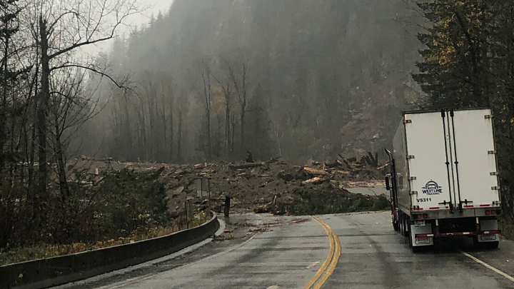 Mudslide on highway with semi-truck