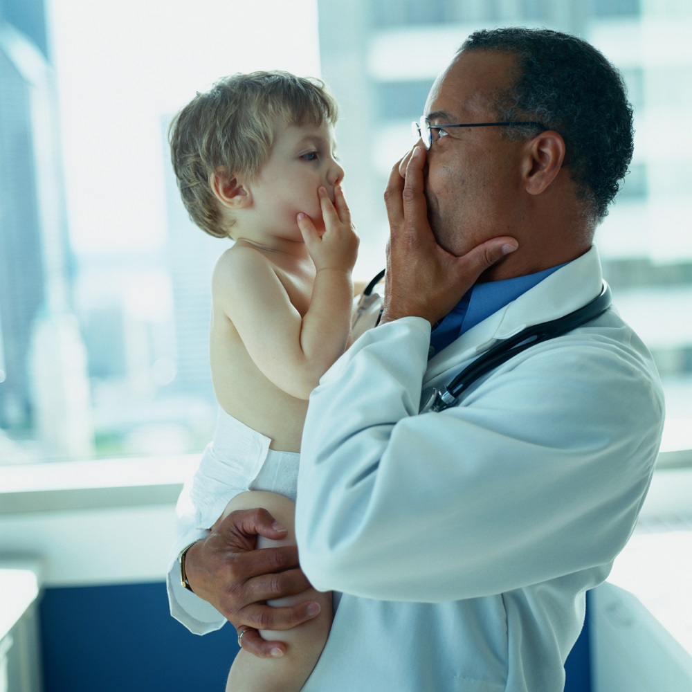 Doctor playing with child patient