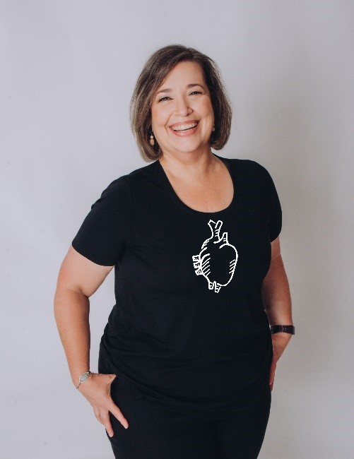 Portrait of Elizabeth Edward wearing a heart transplant T-shirt