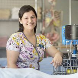 Portrait of Dawn Tisdale at the bedside