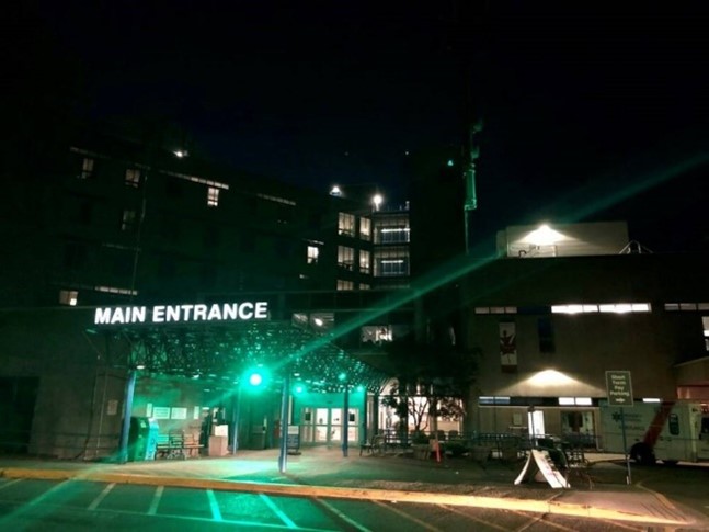 Victoria General Hospital lit up in green