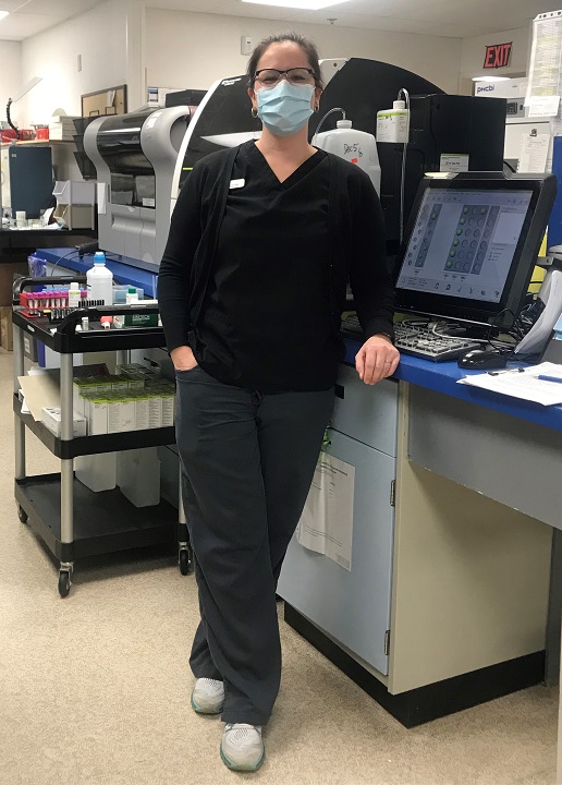 Woman wearing a face mask in a lab