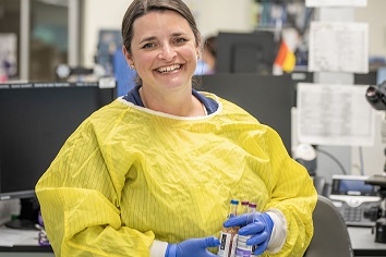 Smiling laboratory staff member