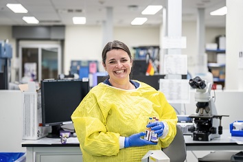 Lab technician smiling